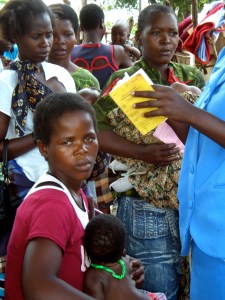 Reviewing a health passport in a mobile clinic