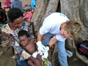 Giving immunizations under a tree