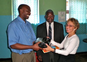 Rev Eston Pembamoyo receiving a projector from me with Bernard Ngoso looking on